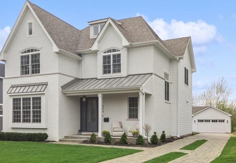 826 South Grove Avenue Barrington, IL 60010 - Photo 1 of 34 a front view of a house with a yard and garage