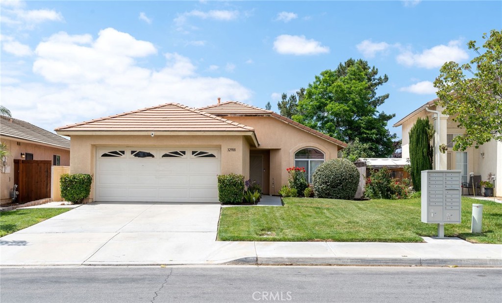 32988 Tulley Ranch Road Temecula, CA 92592 - Photo 1 of 1 a front view of a house with a yard and garage
