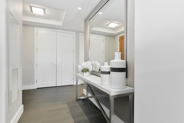 a room with a table chairs and entryway