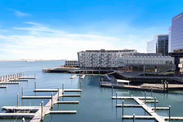 a view of a lake with tall building