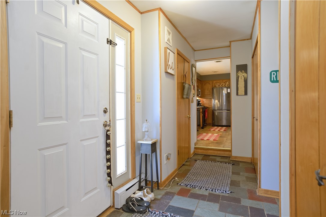 4061 Marks Rootstown, OH 44272 - Photo 17 of 25 Tiled foyer entrance with a baseboard radiator
