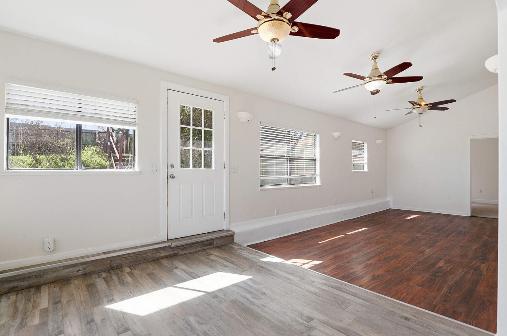 128 Skyview Terrace Leander, TX 78641 - Photo 9 of 23 Sunken Family room, with hard floors and multiple ceiling fans.