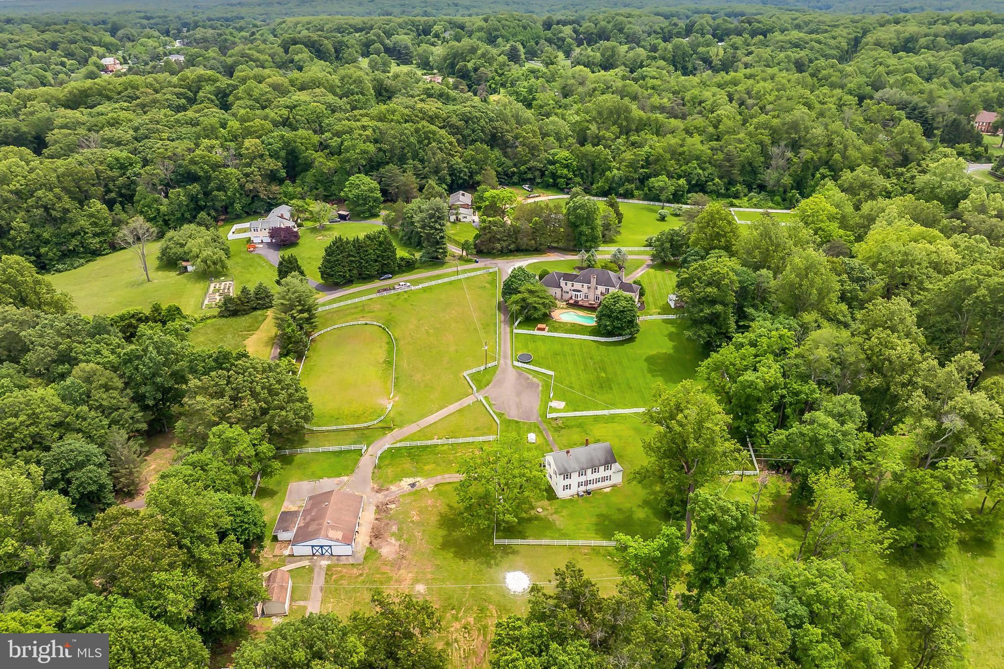 13310 Compton Road Clifton, VA 20124 - Photo 115 of 117 an aerial view of a residential houses with yard and swimming pool