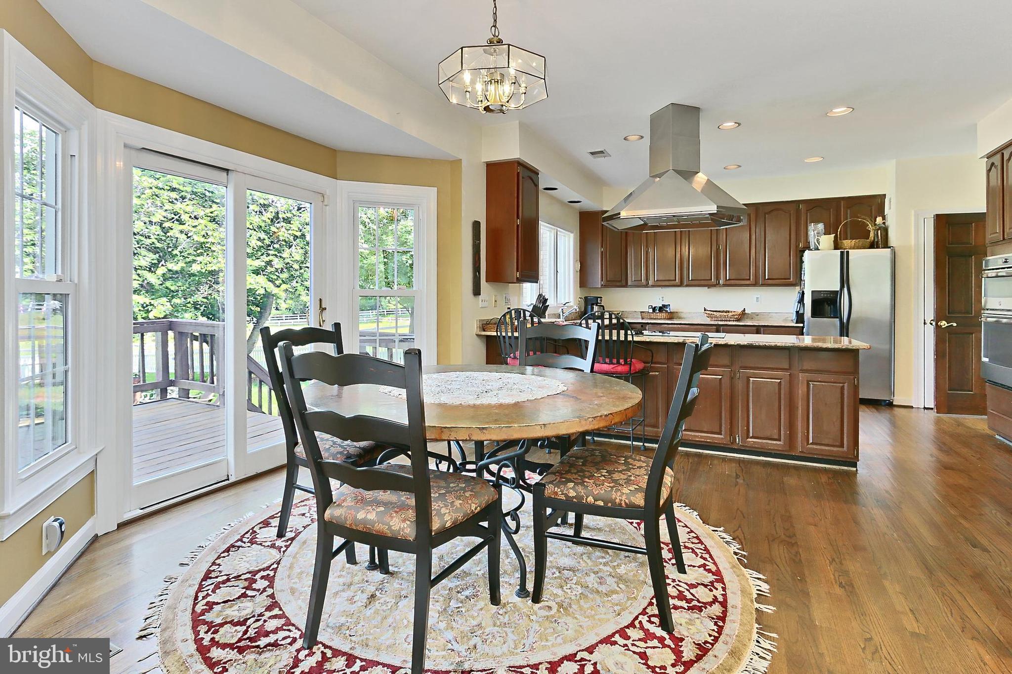 13310 Compton Road Clifton, VA 20124 - Photo 22 of 117 a view of a dining room with furniture window and wooden floor