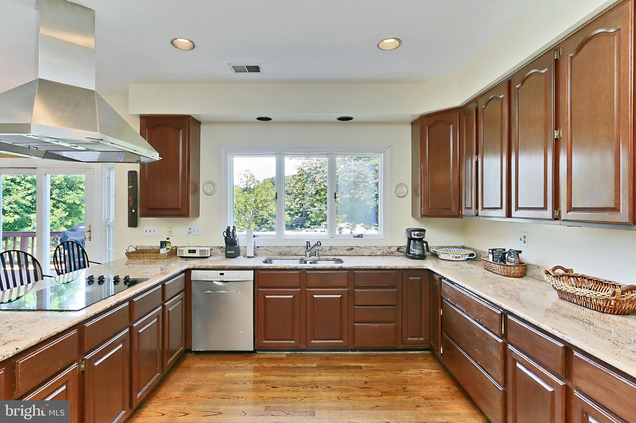 13310 Compton Road Clifton, VA 20124 - Photo 26 of 117 a kitchen with a sink stove and cabinets