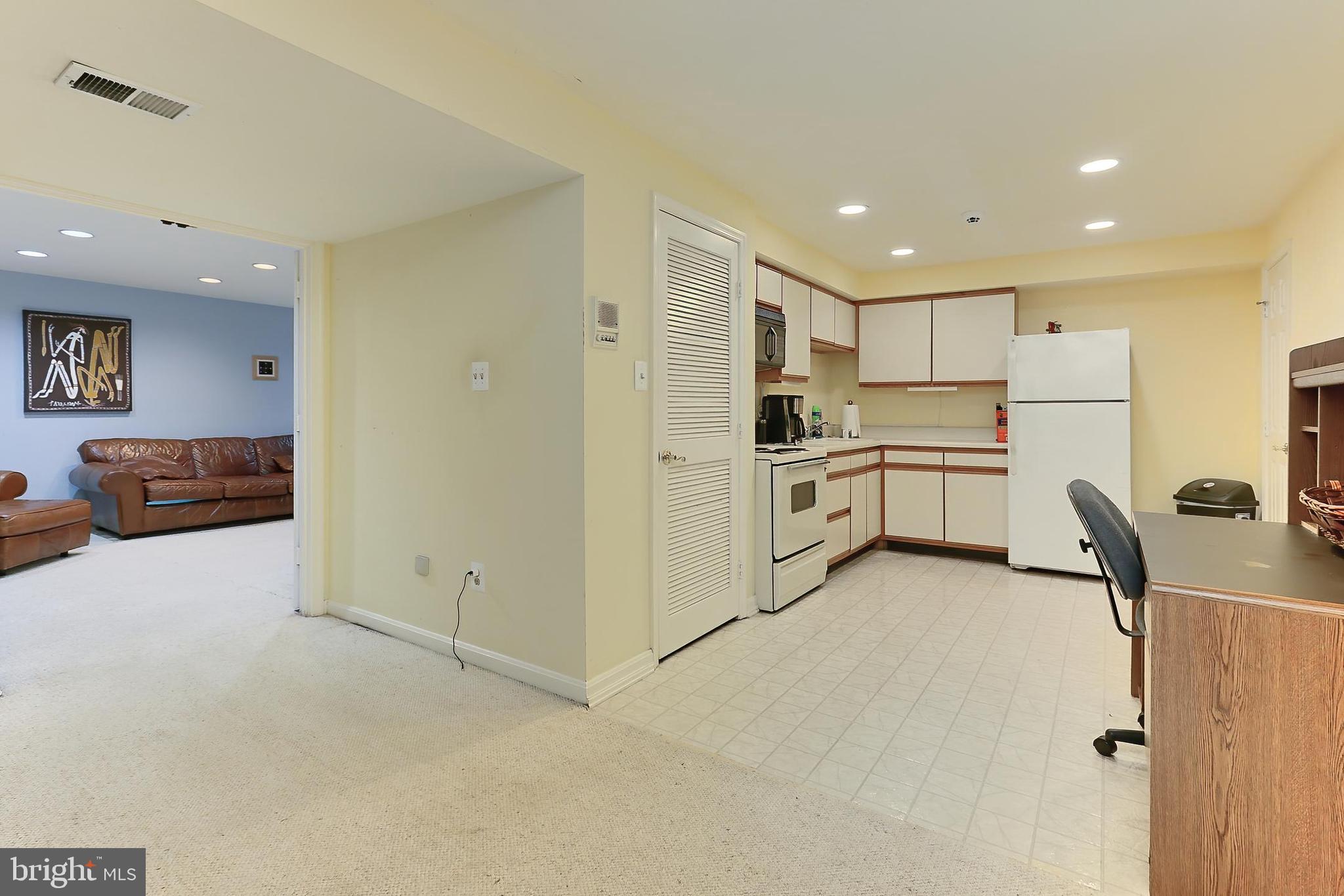 13310 Compton Road Clifton, VA 20124 - Photo 54 of 117 a kitchen with white cabinets and stainless steel appliances