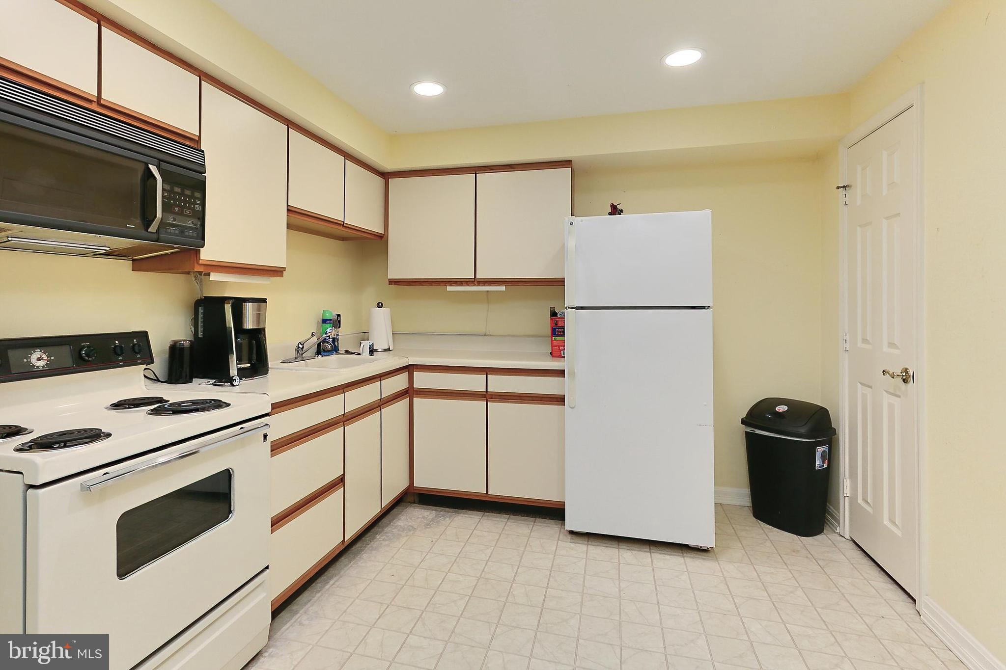 13310 Compton Road Clifton, VA 20124 - Photo 55 of 117 a kitchen with stainless steel appliances a refrigerator sink and microwave