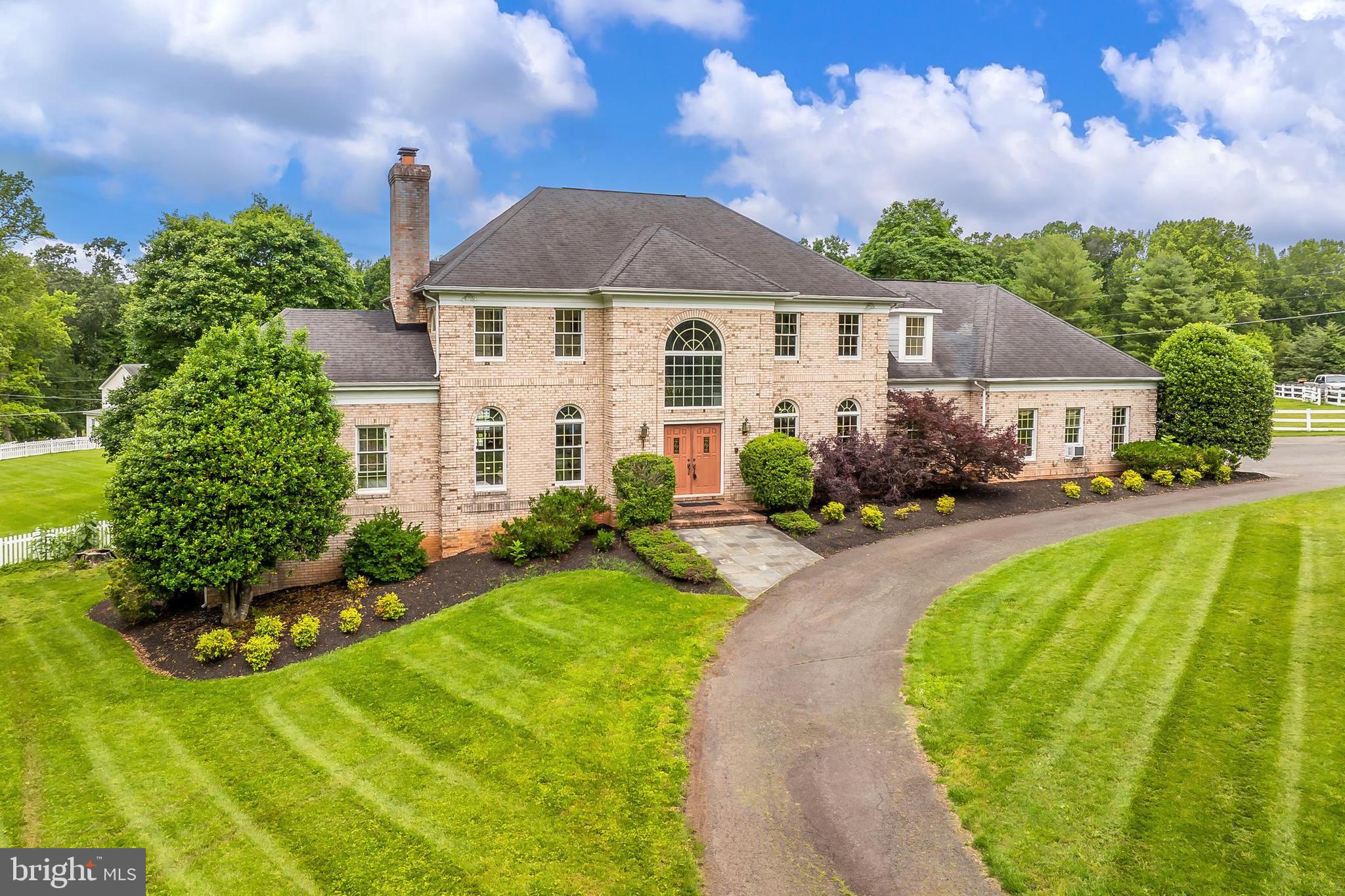 13310 Compton Road Clifton, VA 20124 - Photo 6 of 117 a front view of a house with a yard