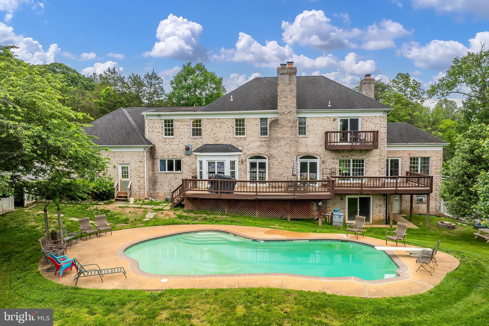 13310 Compton Road Clifton, VA 20124 - Photo 72 of 117 a aerial view of a house with swimming pool and a yard