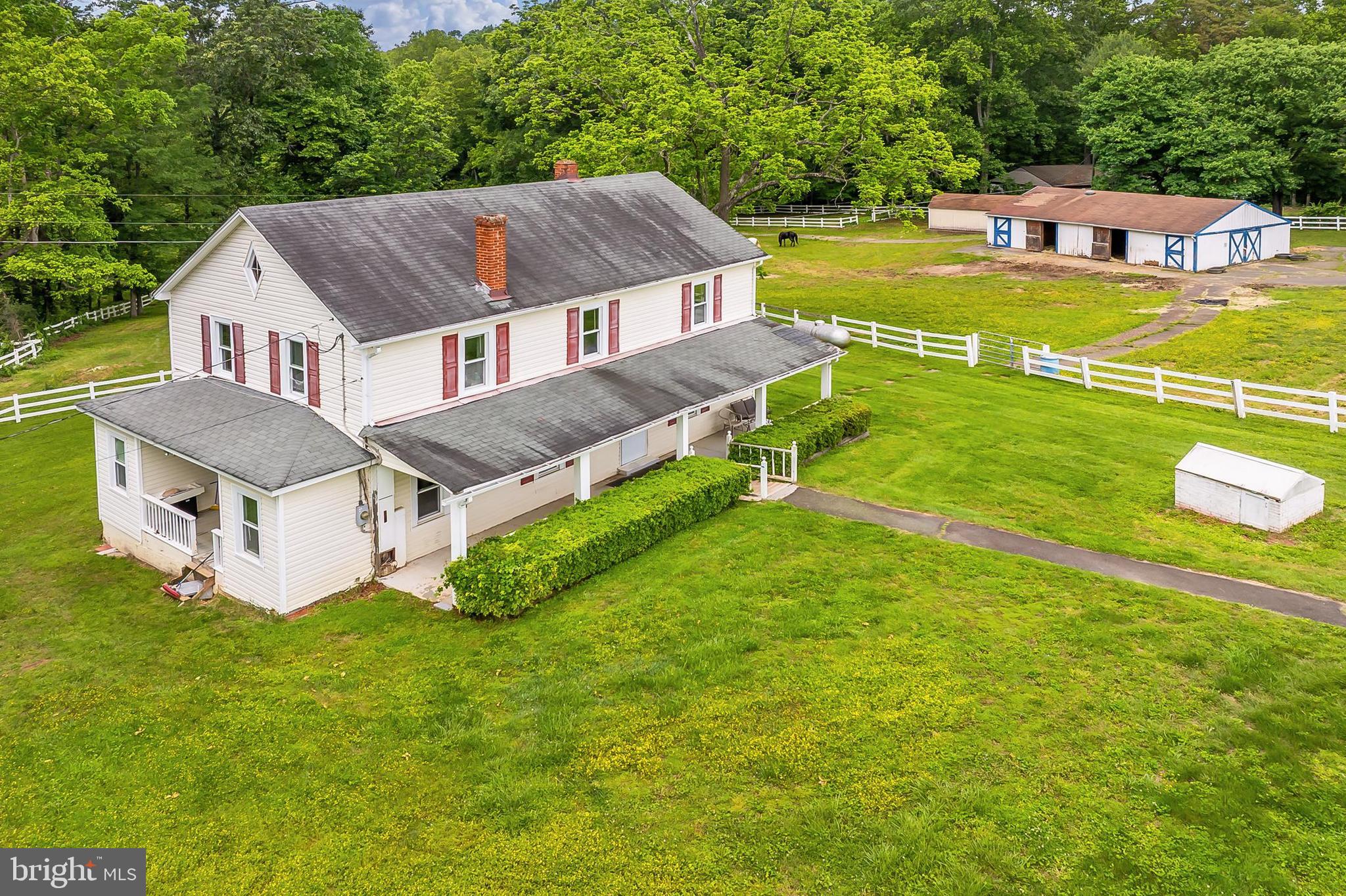 13310 Compton Road Clifton, VA 20124 - Photo 80 of 117 a aerial view of a house with a big yard and large trees