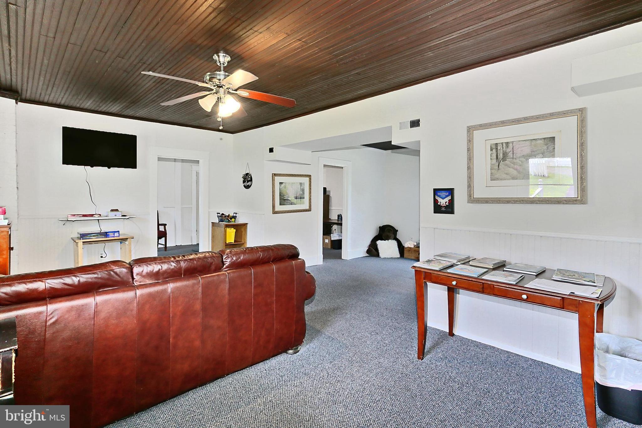 13310 Compton Road Clifton, VA 20124 - Photo 81 of 117 a living room with furniture and a flat screen tv