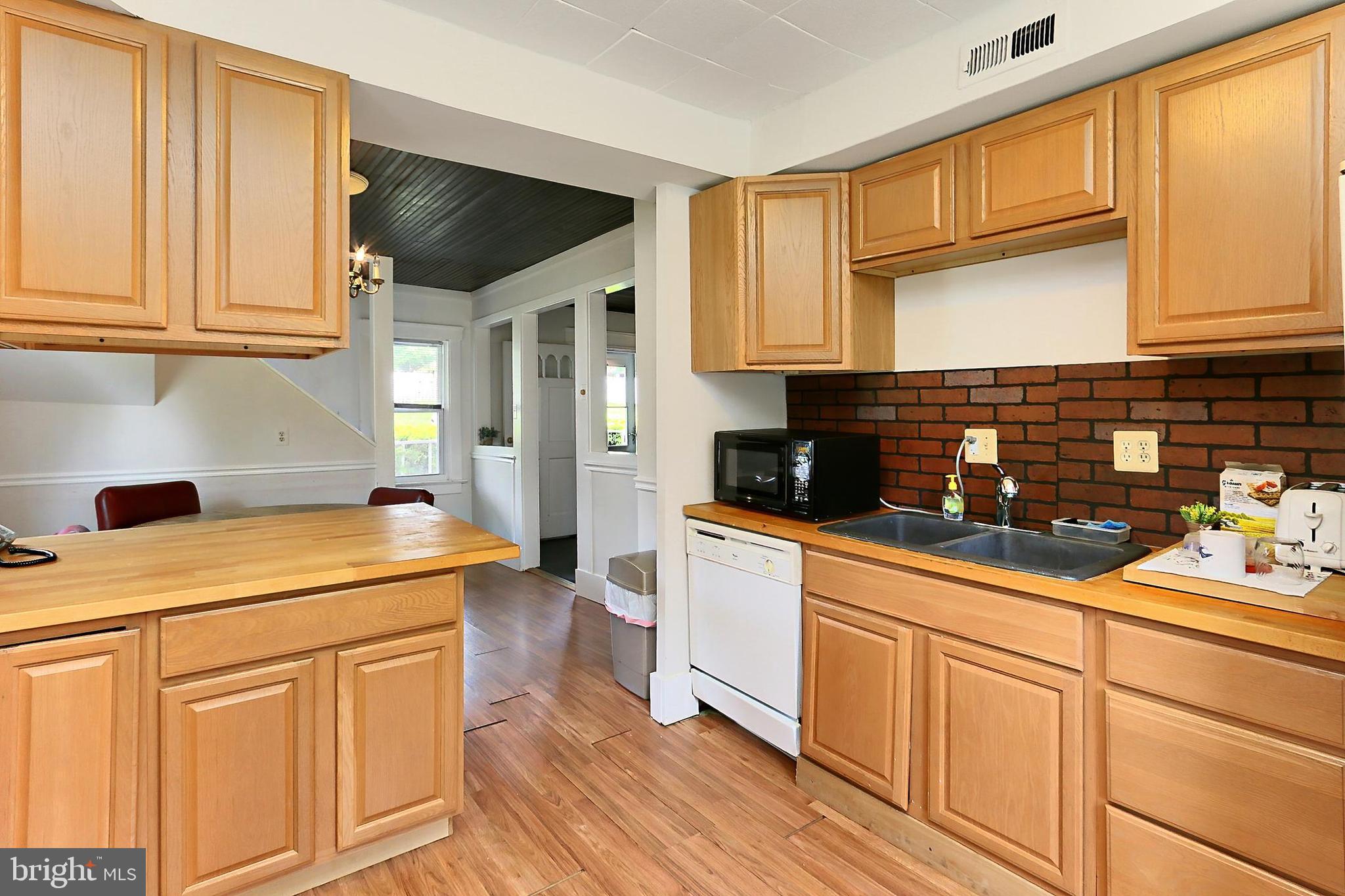 13310 Compton Road Clifton, VA 20124 - Photo 86 of 117 a kitchen with stainless steel appliances granite countertop a sink a stove and cabinets