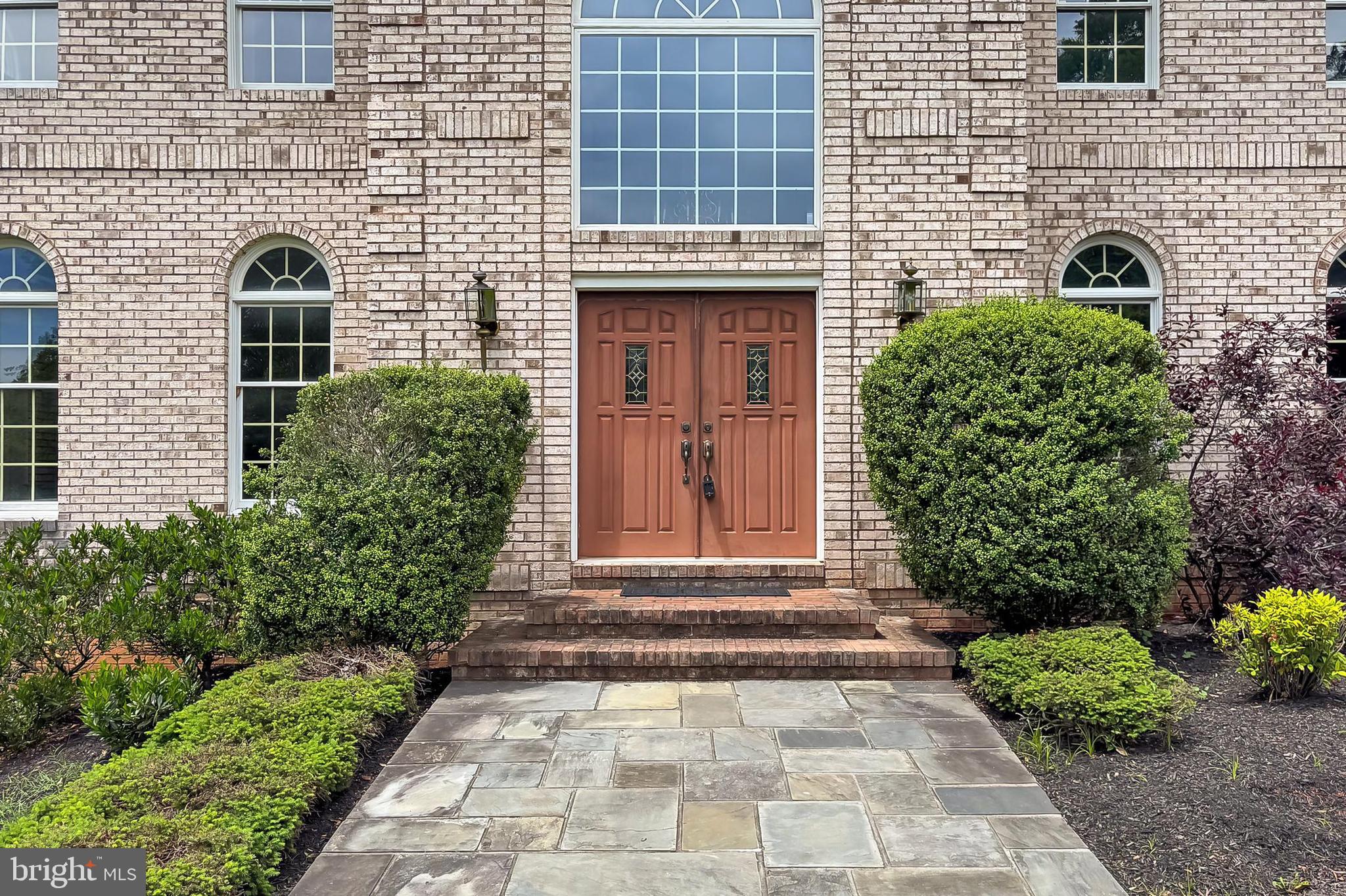 13310 Compton Road Clifton, VA 20124 - Photo 9 of 117 a front view of a house with a garden