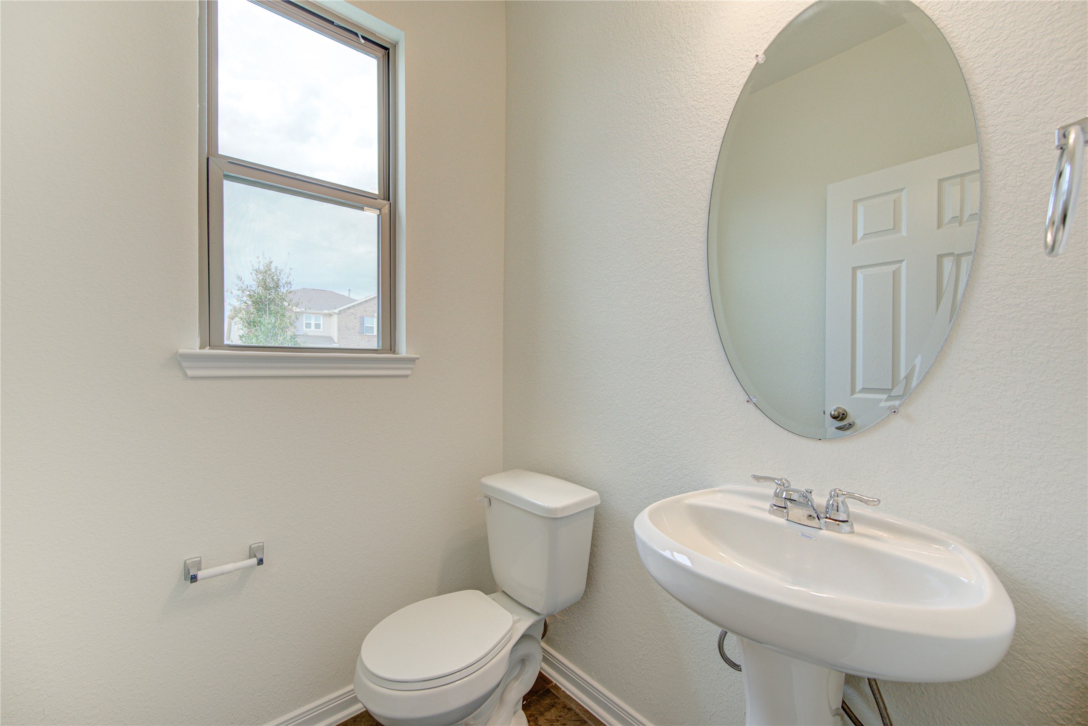 6120 Whitewing Road Rosenberg, TX 77469 - Photo 11 of 50 a bathroom with a sink a mirror and a toilet