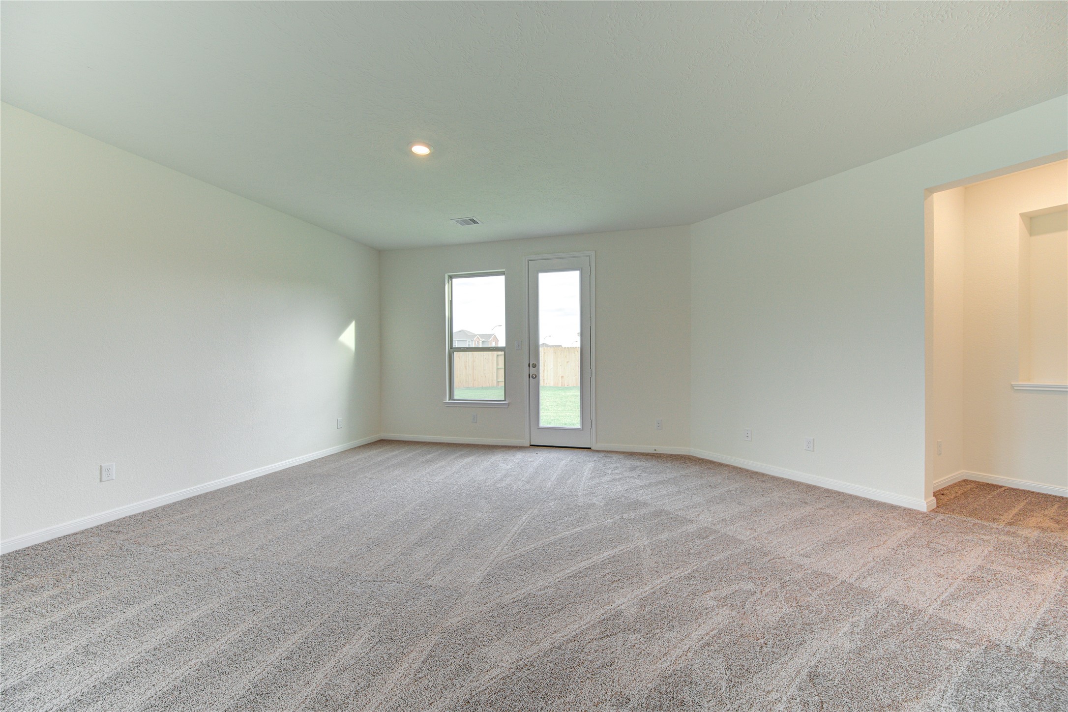 6120 Whitewing Road Rosenberg, TX 77469 - Photo 16 of 50 a view of an empty room with a window