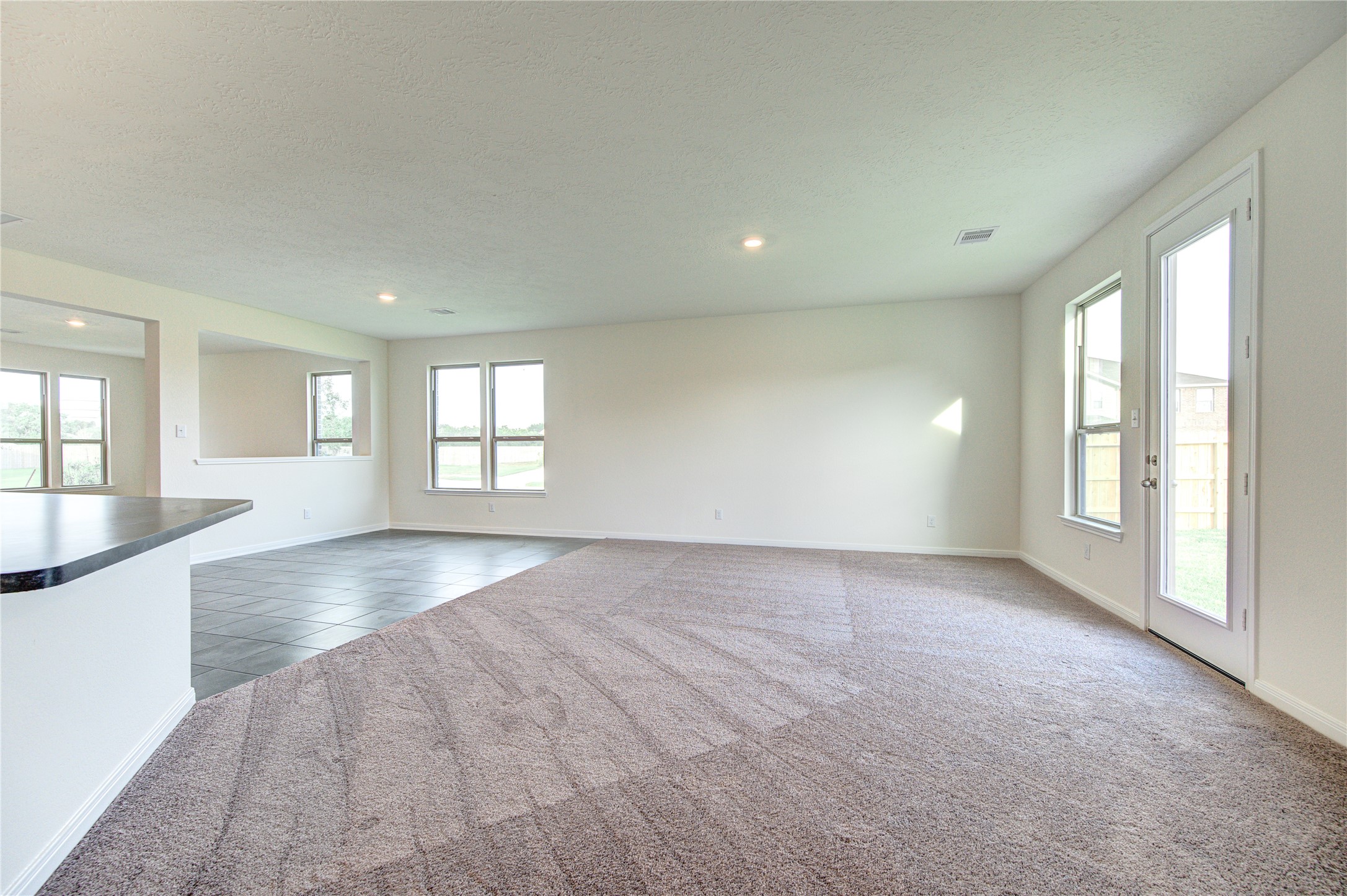 6120 Whitewing Road Rosenberg, TX 77469 - Photo 19 of 50 wooden floor in an empty room with a window
