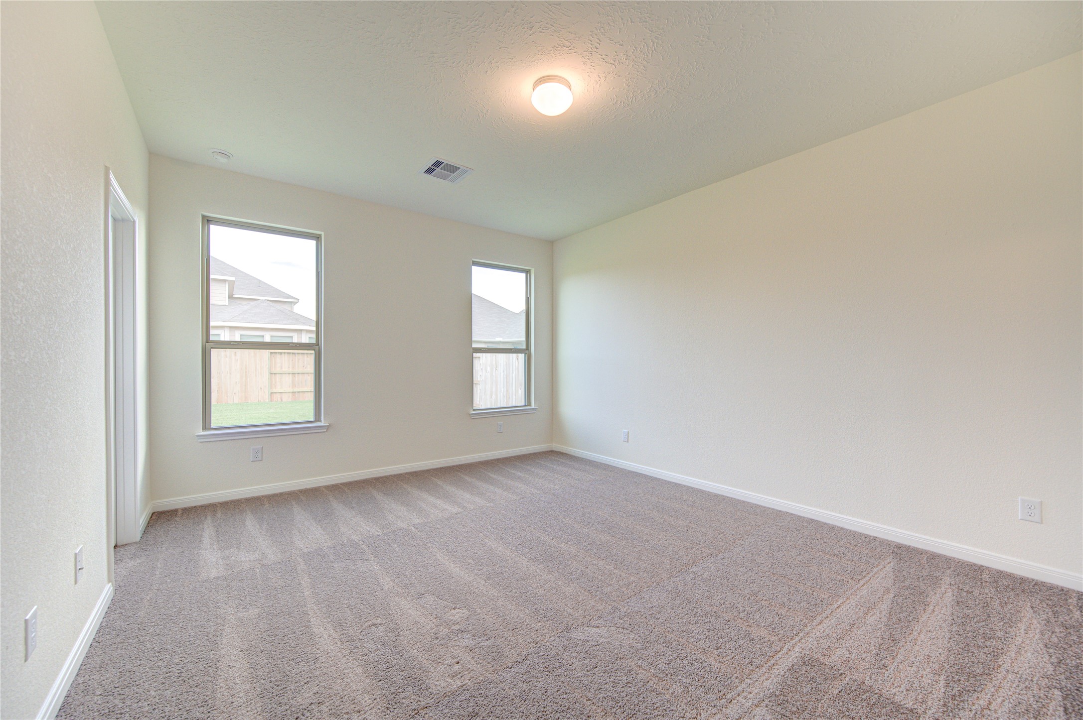 6120 Whitewing Road Rosenberg, TX 77469 - Photo 28 of 50 an empty room with windows