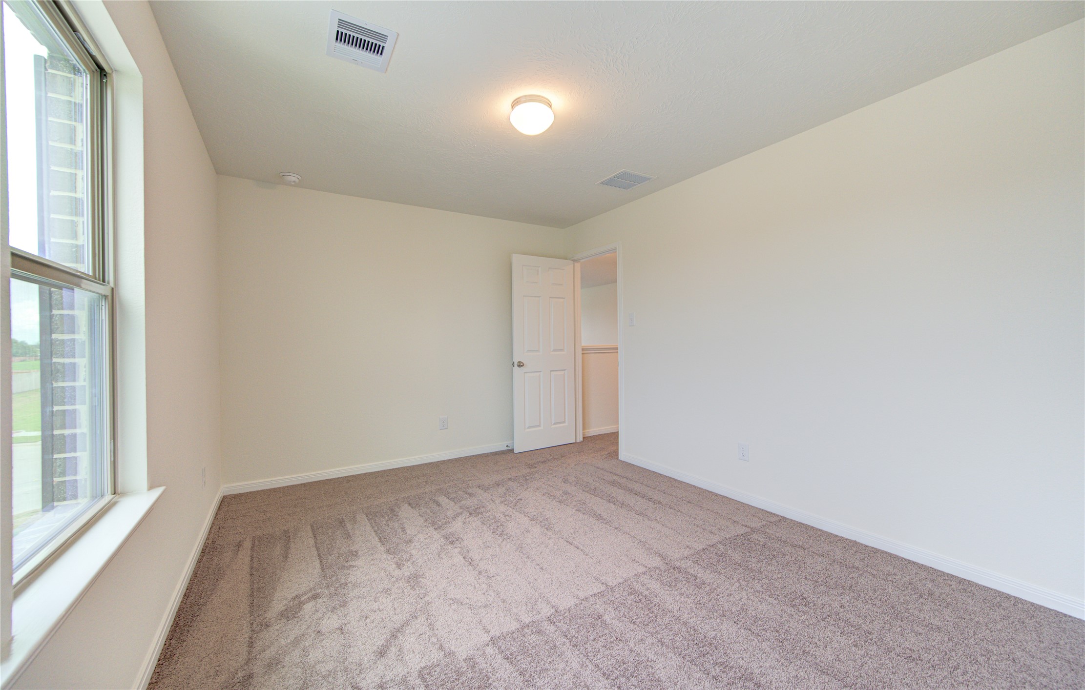 6120 Whitewing Road Rosenberg, TX 77469 - Photo 39 of 50 a view of an empty room and window