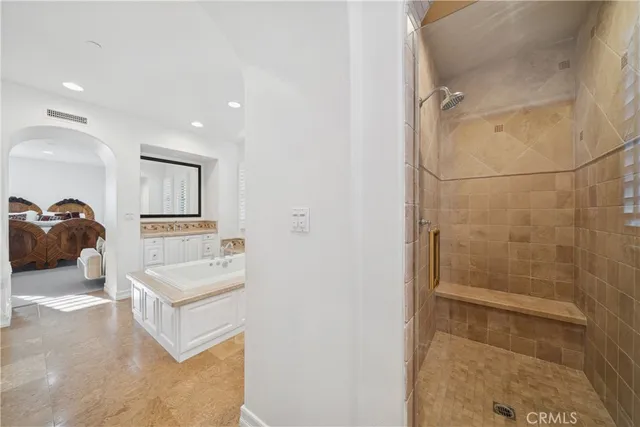 a bathroom with a sink a mirror and shower