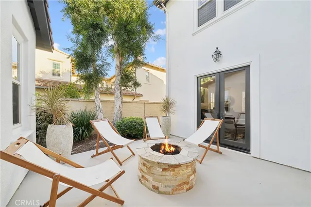 a view of a patio with a dining table and chairs