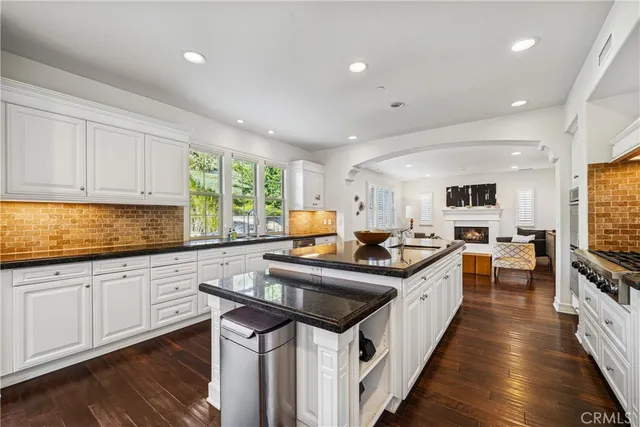 a kitchen with stainless steel appliances a sink and cabinets