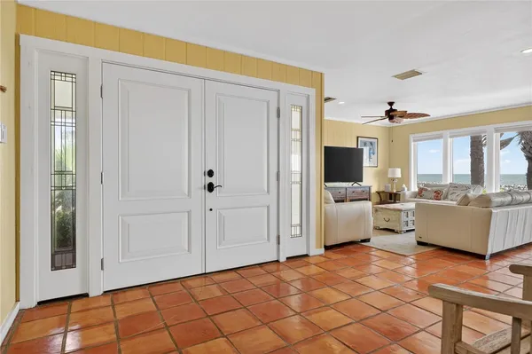a view of a livingroom with furniture and staircase