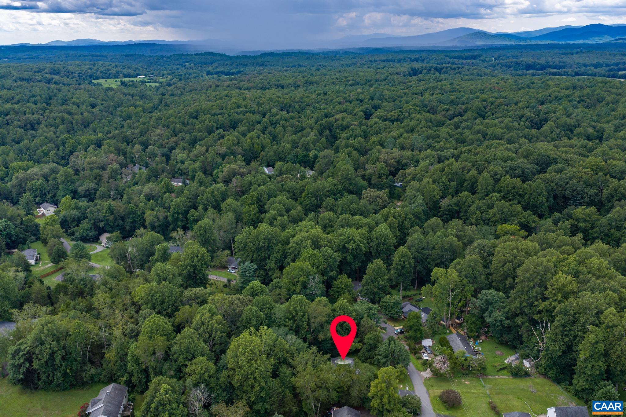 61 Snapdragon Road Ruckersville, VA 22968 - Photo 42 of 47 Expansive aerial shot highlighting the home's exact pin-pointed location nestled among lush, dense treetops! Sweeping mountain vistas and rolling green hills create a private, tranquil sanctuary with unbeatable natural scenery.
