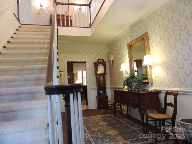 a front view of a house with outdoor seating