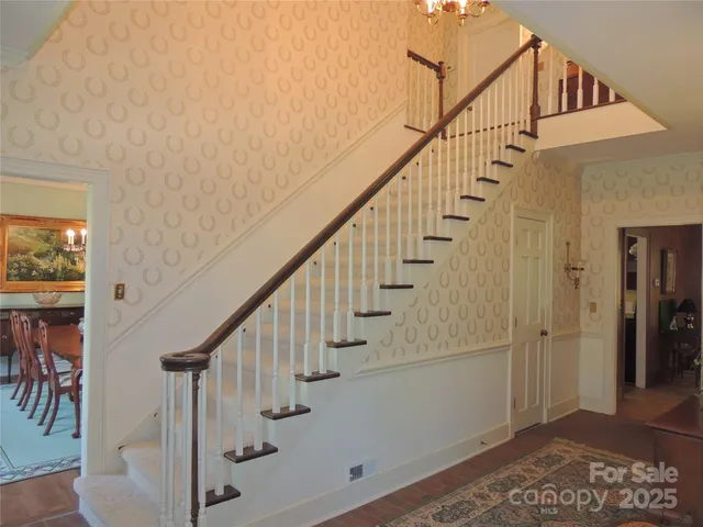 a view of entryway with wooden floor