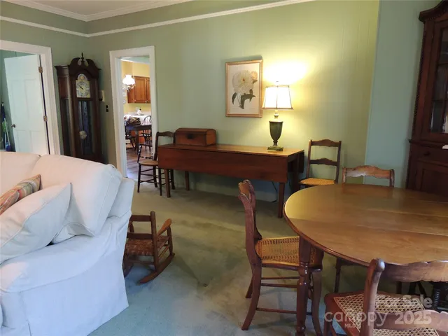 a view of kitchen with furniture and windows