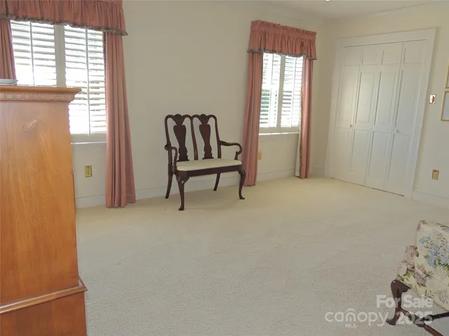 a living room with furniture and a lamp