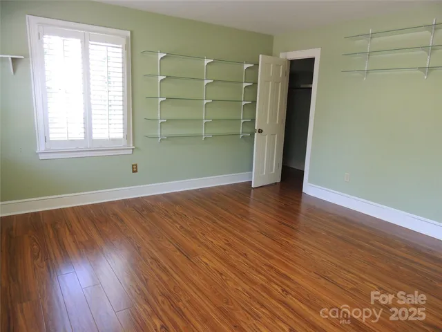 a room with a table and a mirror