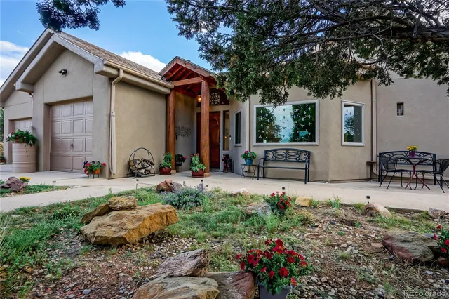 a front view of a house with garden