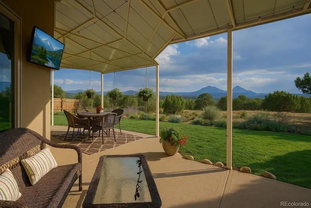 a view of yard with patio