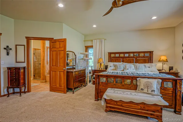 a bedroom with furniture and window