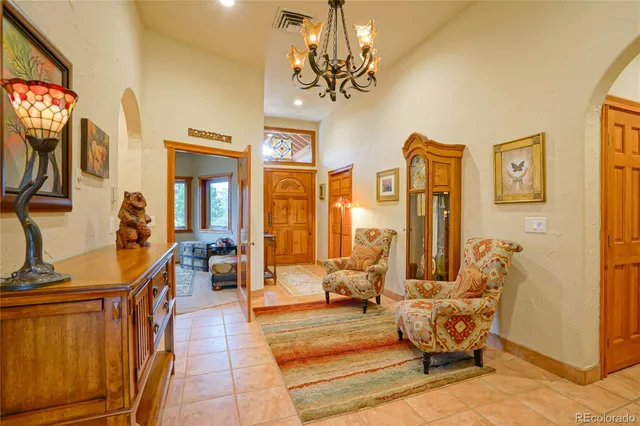 a living room with fireplace furniture and a flat screen tv
