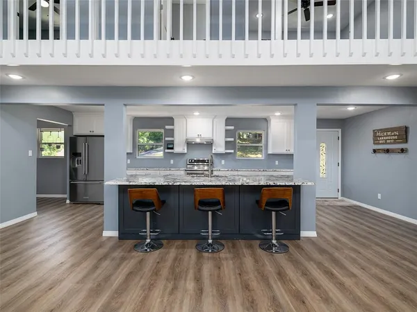 a kitchen with a table and chairs in it