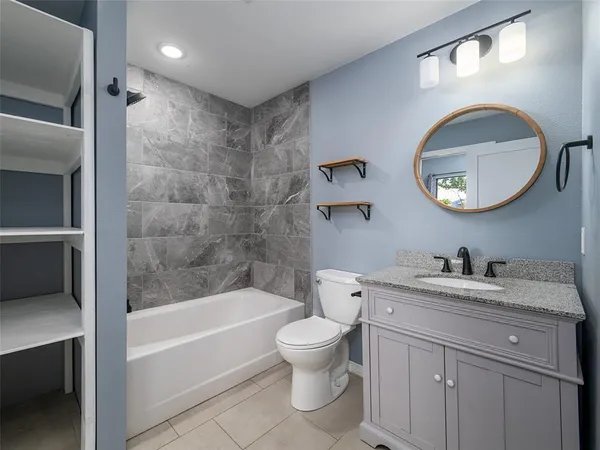 a bathroom with a toilet a sink and a bathtub