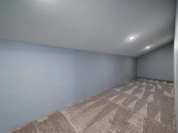 a front view of house along with trees