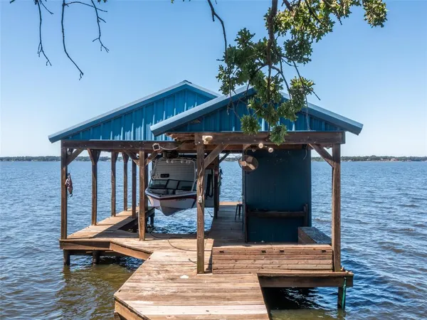 a view of a chairs and table in the balcony