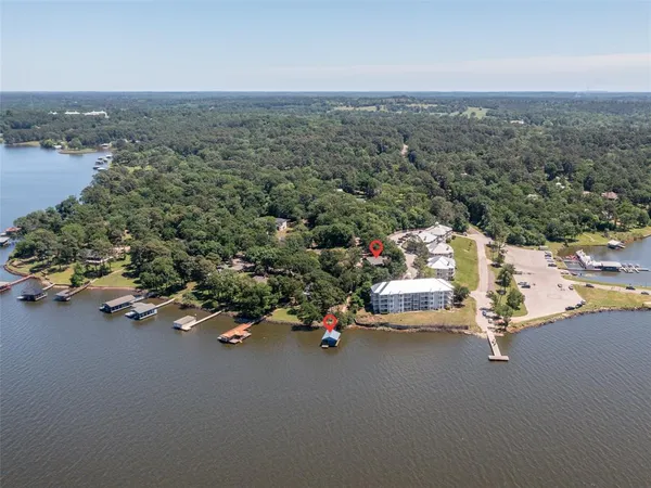 an aerial view of a houses with a street