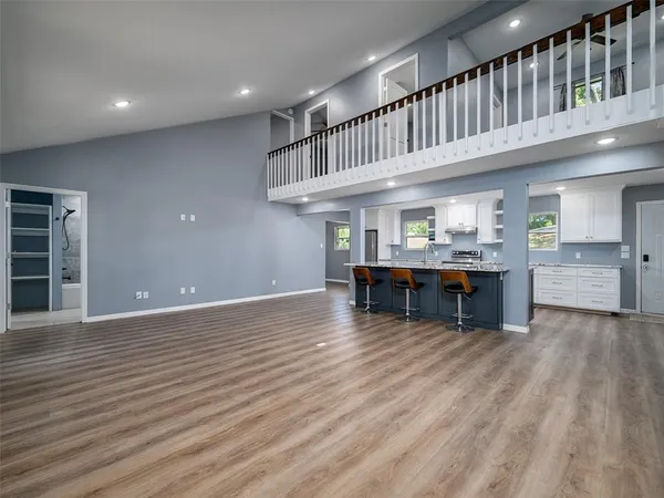 a view of kitchen with furniture and wooden floor