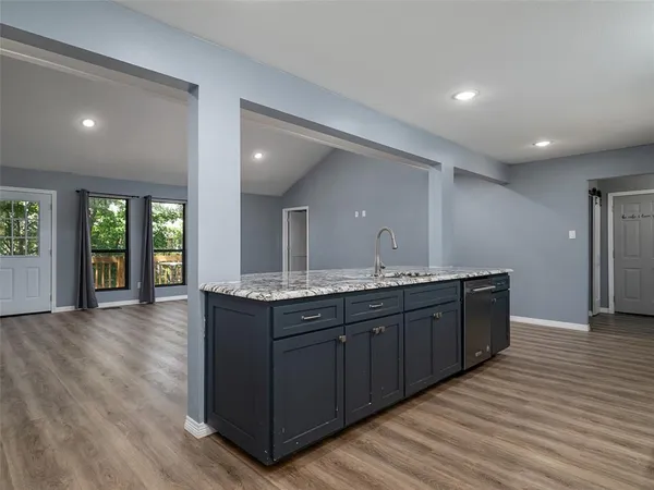 a large bathroom with double vanity and a large mirror
