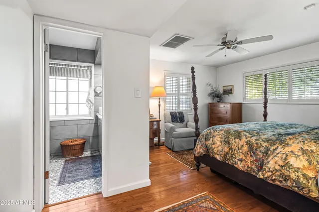 a bedroom with bed and window