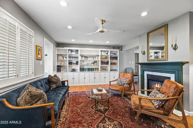 a living room with furniture and a fireplace