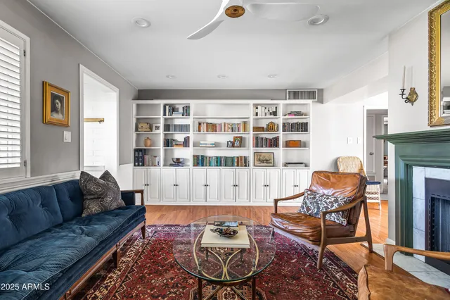 a living room with furniture and a fireplace