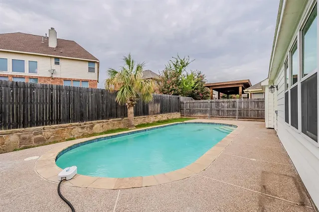 a view of outdoor space and swimming pool