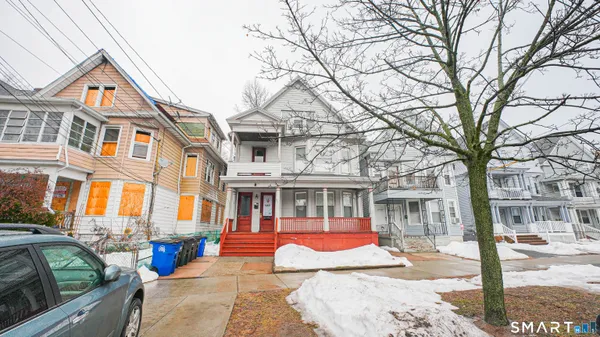 a view of a brick building with large windows