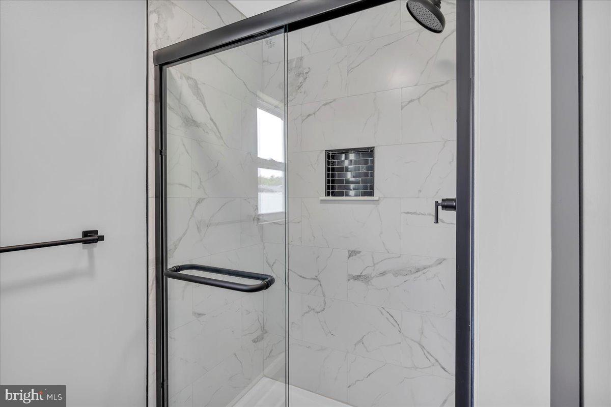 147 Country Club Road Pine Hill, NJ 08021 - Photo 11 of 53 a bathroom with a glass shower door