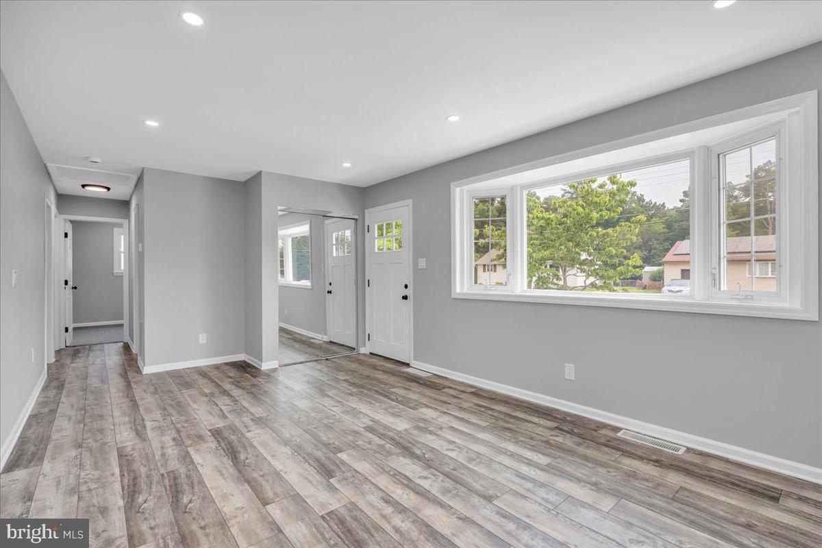 147 Country Club Road Pine Hill, NJ 08021 - Photo 36 of 53 a view of an empty room with wooden floor and a window